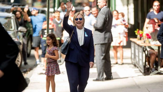 Hillary Clinton waves after leaving her daughter's apartment after her health turn on September 11. Some conspiracy theorists claimed that this is a body double and not Mrs Clinton.