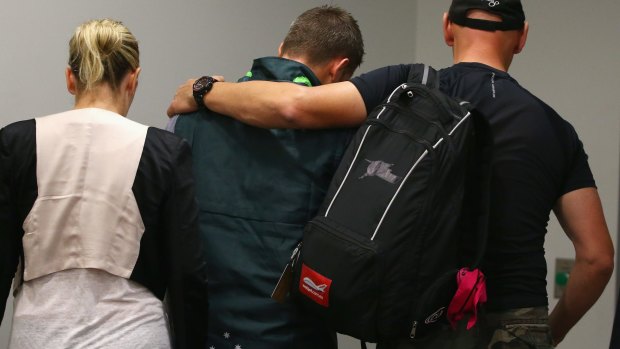 Distraught: Michael Clarke leaves the room after reading a statement on behalf of the team.