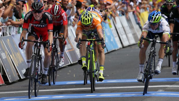  Simon Gerrans (right) edges out BMC's Rohan Dennis on the line totake the overall lead in the Tour Down Under.