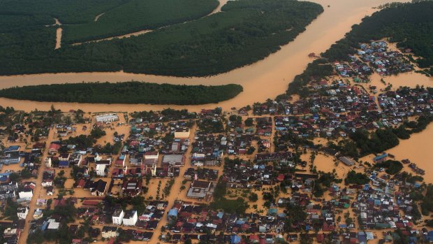 Submerged houses and plantations at Pengkalan Chepa, Malaysia.