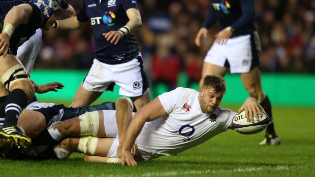 Encouraging start: Lock George Kruis crashes over to score the opening try.