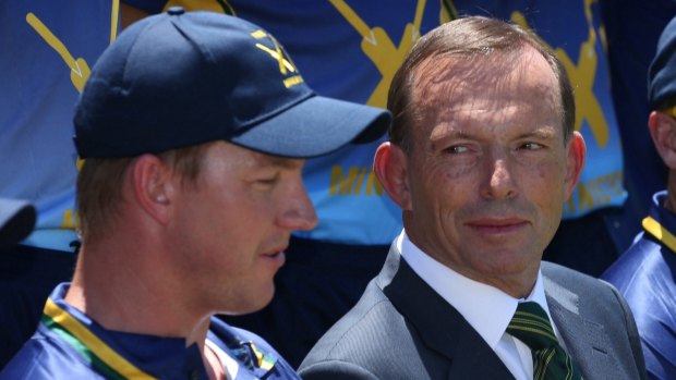 Prime Minister Tony Abbott, pictured at the PM's XI in Canberra on Wednesday, has defended his government's decision to cut the rebate.