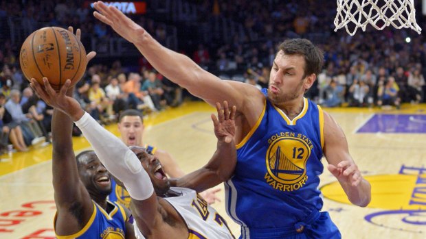 No way through: Andrew Bogut and Draymond Green make it hard for Lakers star Kobe Bryant to get to the basket.