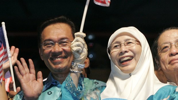 Malaysian opposition leader Anwar Ibrahim, now jailed, with his wife Wan Azizah at a rally at in Petaling Jaya, Malaysia, in 2008.  