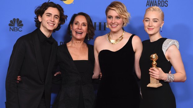 Timothee Chalamet (from left), Laurie Metcalf, Greta Gerwig and Saoirse Ronan after winning their Golden Globe for best motion picture - musical or comedy for <i>Lady Bird</i>. 
