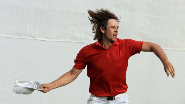 Aaron Baddeley celebrates after his putt on the fourth hole of the playoff to win against Si Woo Kim.