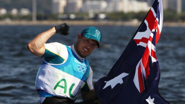 Tom Burton with an Australian flag after the win.