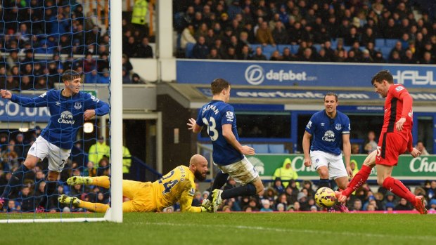 David Nugent scores Leicester City's first goal against Everton at Goodison Park on Sunday.