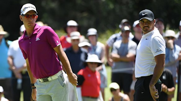 Down the leaderboard: Lucas Herbert misses a birdie putt as playing partner Jason Day watches on. The pair failed to play out an expected David and Goliath battle for honours.