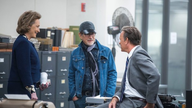 Meryl Streep, left,  director Steven Spielberg, and Tom Hanks on the set of <i>The Post</I>, which portrays newspapers as heroes that dare speak truth to power.