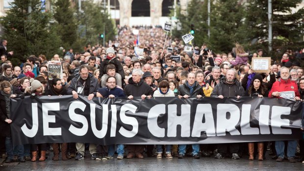 Carrying a banner that reads "Je suis <i>Charlie</i>", thousands of people rally in Lille on January 10 after three days of terror.