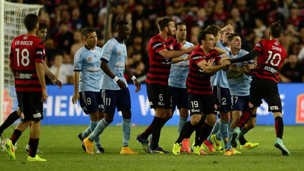 Red mist: Sydney and Wanderers players clash after Vitor Saba's nasty challenge on Terry Antonis.
