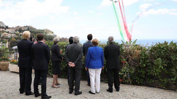 G7 leaders attend a flypast at San Domenico Palace Hotel in Taormina, Italy. 