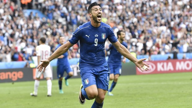 Job done: Graziano Pelle celebrates after scoring Italy's second goal.