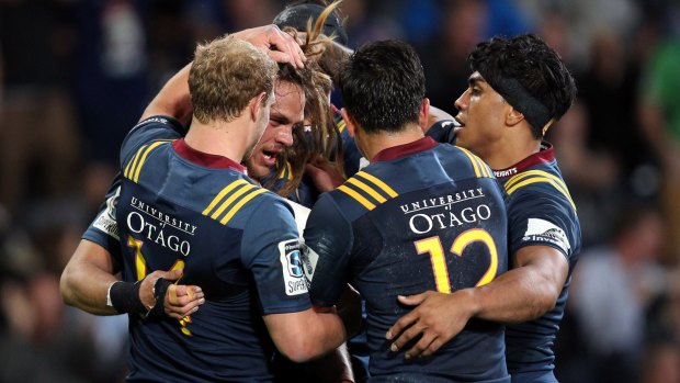 Comeback: Dan Pryor of the Highlanders celebrates with his teammates after scoring a try.