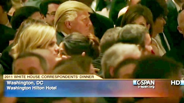 Butt of jokes: Donald Trump (centre left) listens at the 2011 White House Correspondents' Association dinner.