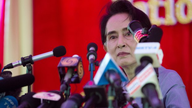Nobel Laureate Aung San Suu Kyi addresses the media at her home in Yangon, Myanmar on Thursday.