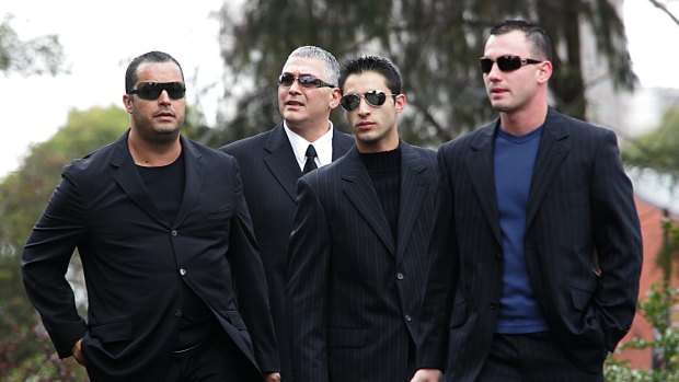 Mick Gatto (second from left) and crew arrive at Saint Ignatius Church in Richmond for the funeral of Mario Condello.