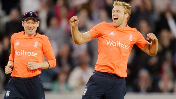 England captain Eoin Morgan, left, and David Willey celebrate the final wicket.