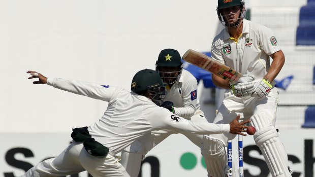 At full stretch: Azhar Ali reaches for a shot from Mitchell Marsh on the fifth day of the second Test.