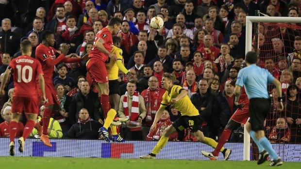 Leaving it late: Dejan Lovren headed in the final goal in Liverpool's thrilling 4-3 win over Borussia Dortmund.