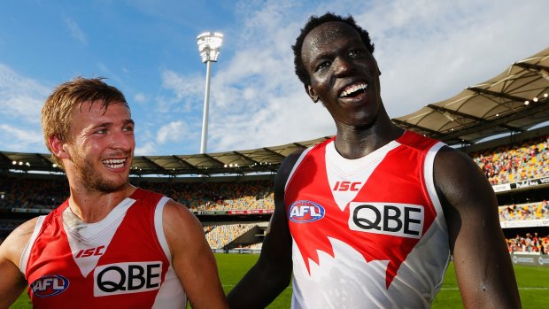 Sydney's Kieren Jack and rookie defender Aliir Aliir celebrate the win on Sunday.