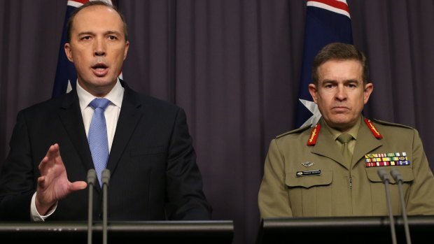 Immigration Minister Peter Dutton and Major General Andrew Bottrell at Parliament House on Friday.