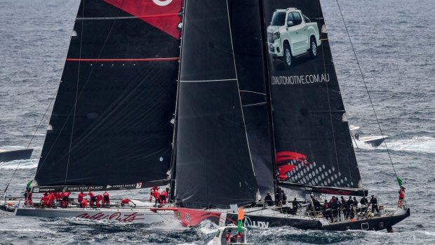 Near miss: LDV Comanche (right) and Wild Oats XI narrowly miss each other as they tack outside the Heads at the start of the 73rd annual Sydney to Hobart yacht race.