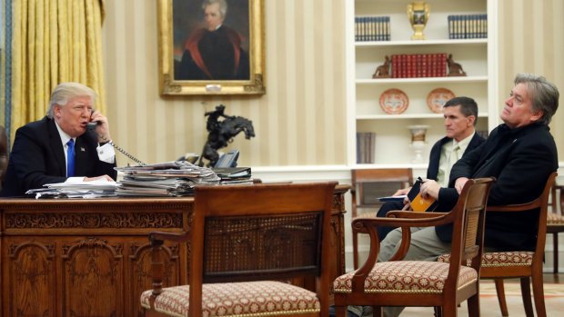 President Donald Trump with Mike Flynn and Steve Bannon in the Oval Office.