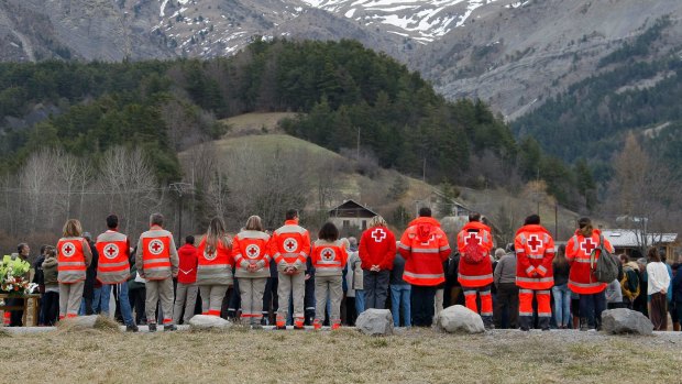 French Red Cross members pay tribute to the victims of the  Germanwings aircraft crash in the French Alps.