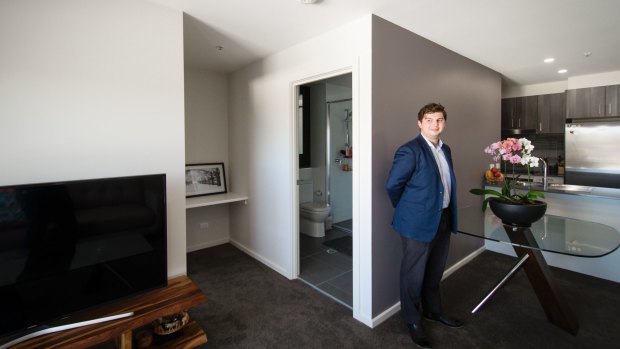 James Lara in his 57-square-metre apartment in Greenway.