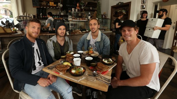 Dining out: Matt Buntine (second from right) with teammates (L-R) Rhys Palmer, Callan Ward and Adam Kennedy at The Grumpy Barista cafe in Petersham.