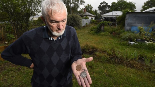 Creswick resident Neville Holmes uncovered the pair of medals belonging to a WWI solider while gardening.