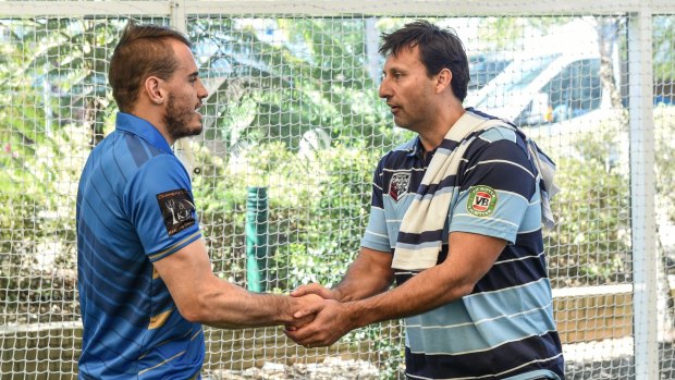 NSW Blues coach Laurie Daley (right) meets with City Origin player Josh Reynolds during the press call for the team.
