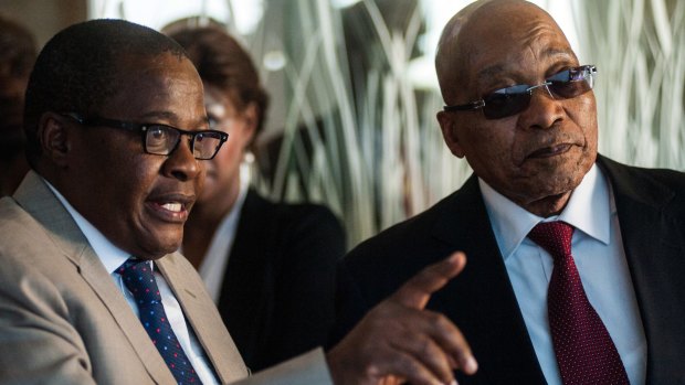 South African President Jacob Zuma, right, is shown around the headquarters of Eskom Holdings in Johannesburg by CEO Brian Molefe earlier this month.