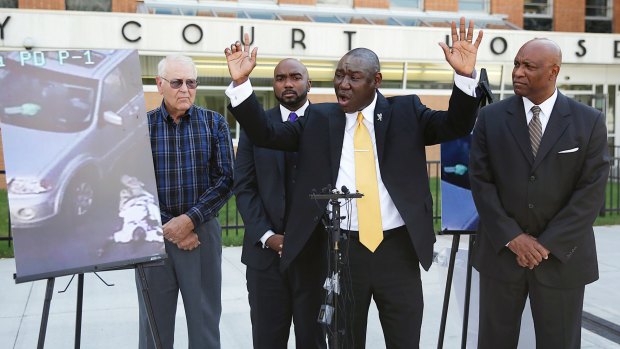 Benjamin Crump, centre, one of the attorneys for the Crutcher family.