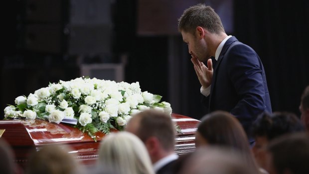 Funeral: Michael Clarke pays his respects.