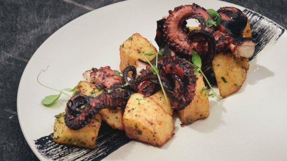 Char-grilled octopus, lemon potatoes and a swipe of squid ink.