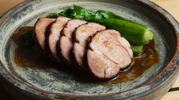 Slow-cooked pork neck with mustard greens.