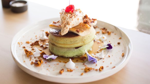 Labld cafe's pandan pancakes  topped with sticky caramelised banana and honeycomb cream.