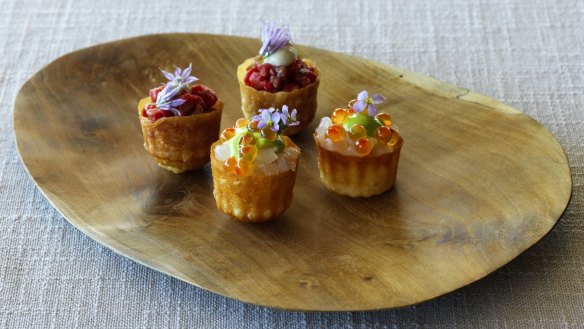 Pie tee shells of carrot waste filled with delicately smoked salmon.