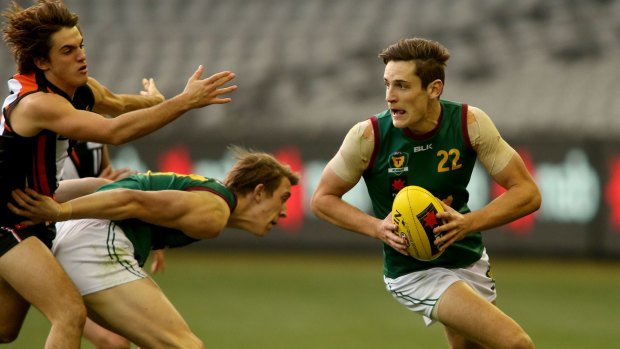 On the burst: Mitchell Hibberd evades an opponent during the under-18 championships