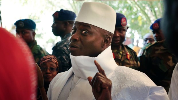 Outgoing Gambian president Yahya Jammeh shows his inked finger during voting in Banjul. He has previously vowed to rule the country for "a billion years".