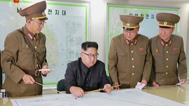 A video broadcast by North Korean television last month shows Kim Jong-un receiving a military briefing in Pyongyang.  