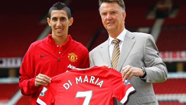 Louis van Gaal poses with bumper Manchester United signing Angel di Maria in August.