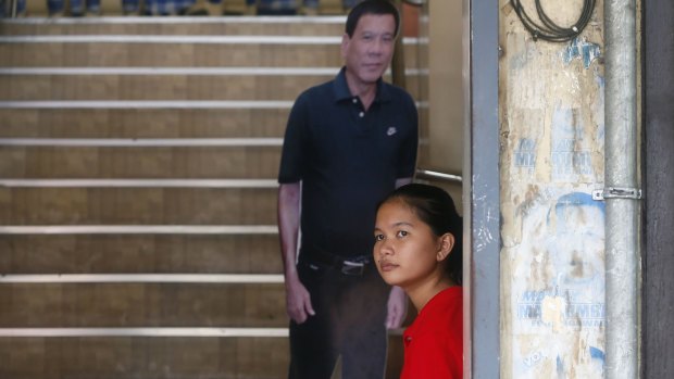 A life-size cutout of President-elect Rodrigo Duterte is placed by the stairs for customers to take a selfie at a restaurant in his hometown in Davao.