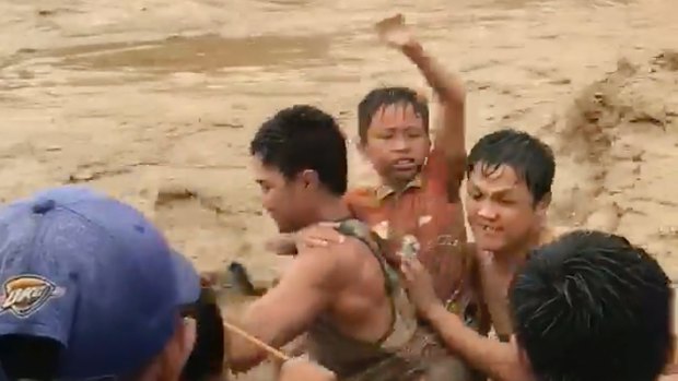 A tropical storm unleashed flash floods and set off landslides in the southern Philippines leaving more than 200 people dead. 