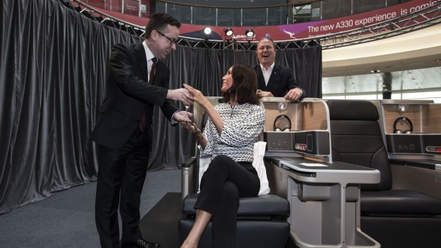 At leisure: Alan Joyce, chef Neil Perry and Qantas Friend Lindy Klim with a mock-up of the new business class configuration.