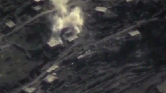 An air strike on a militant base in the province of Latakia, Syria, in an image taken from footage posted on the Russian defence ministry website. 