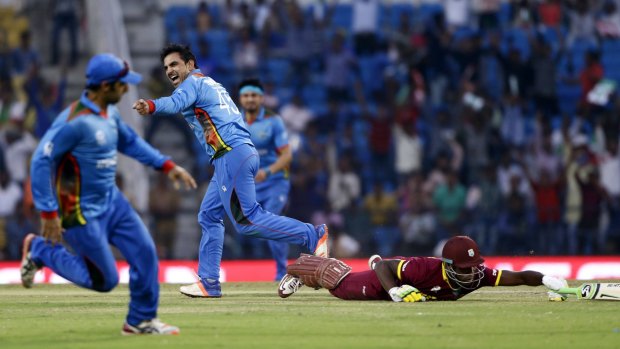 Afghanistan celebrate after running out West Indies' Andre Russell on Sunday.
